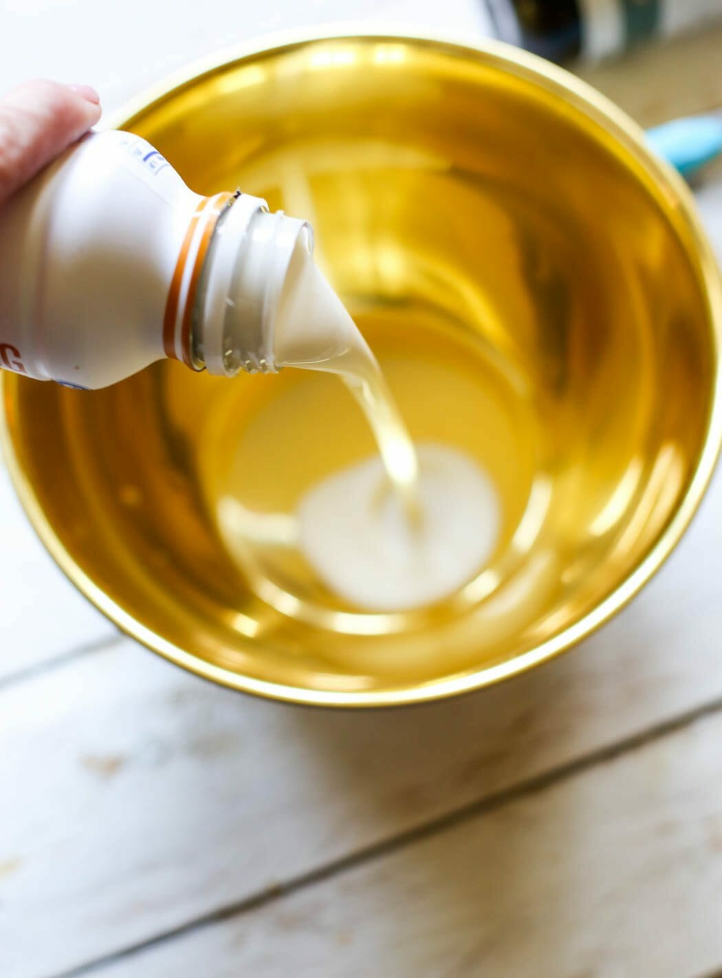Adding whipping cream to bowl