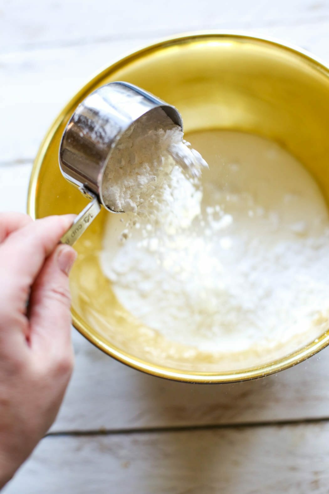 Adding powdered sugar to sweetened whipped cream
