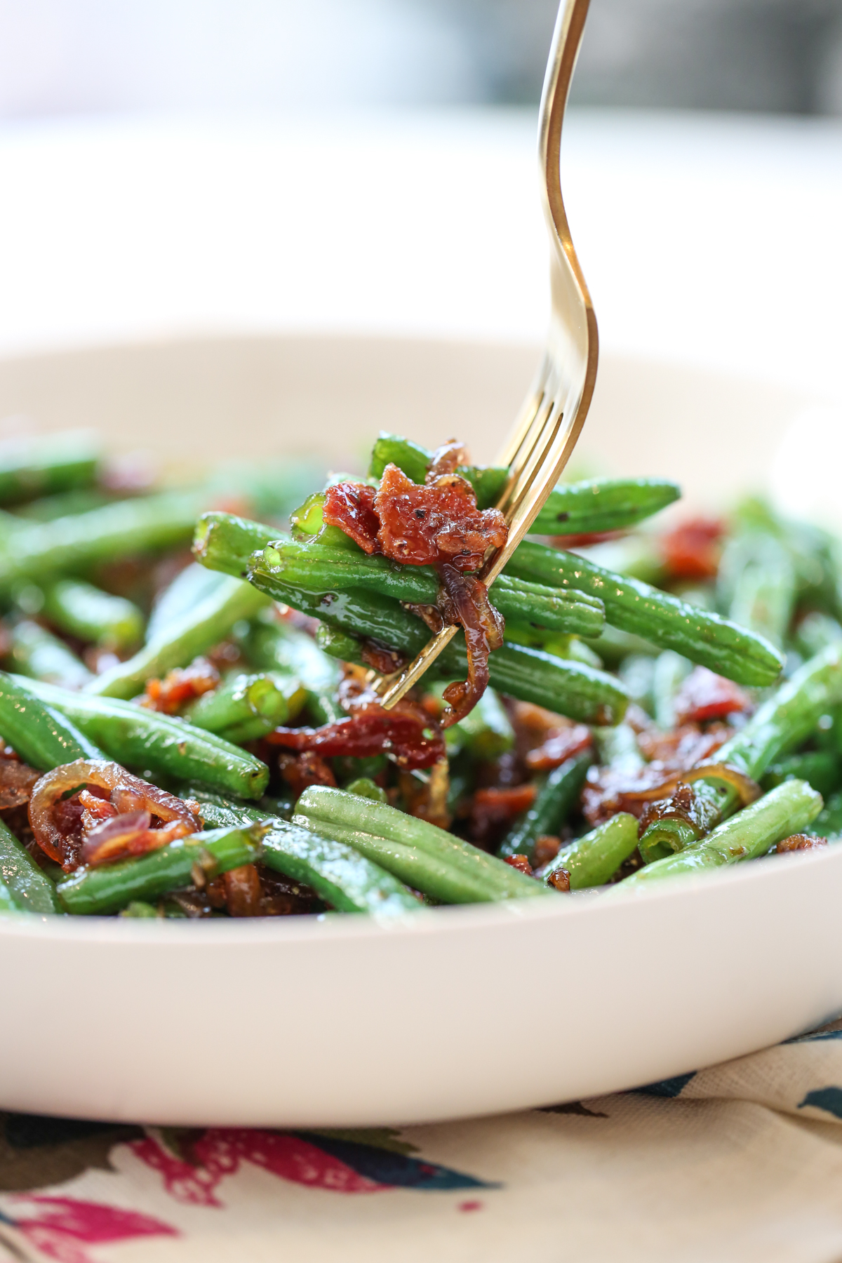 green beans and bacon on a fork