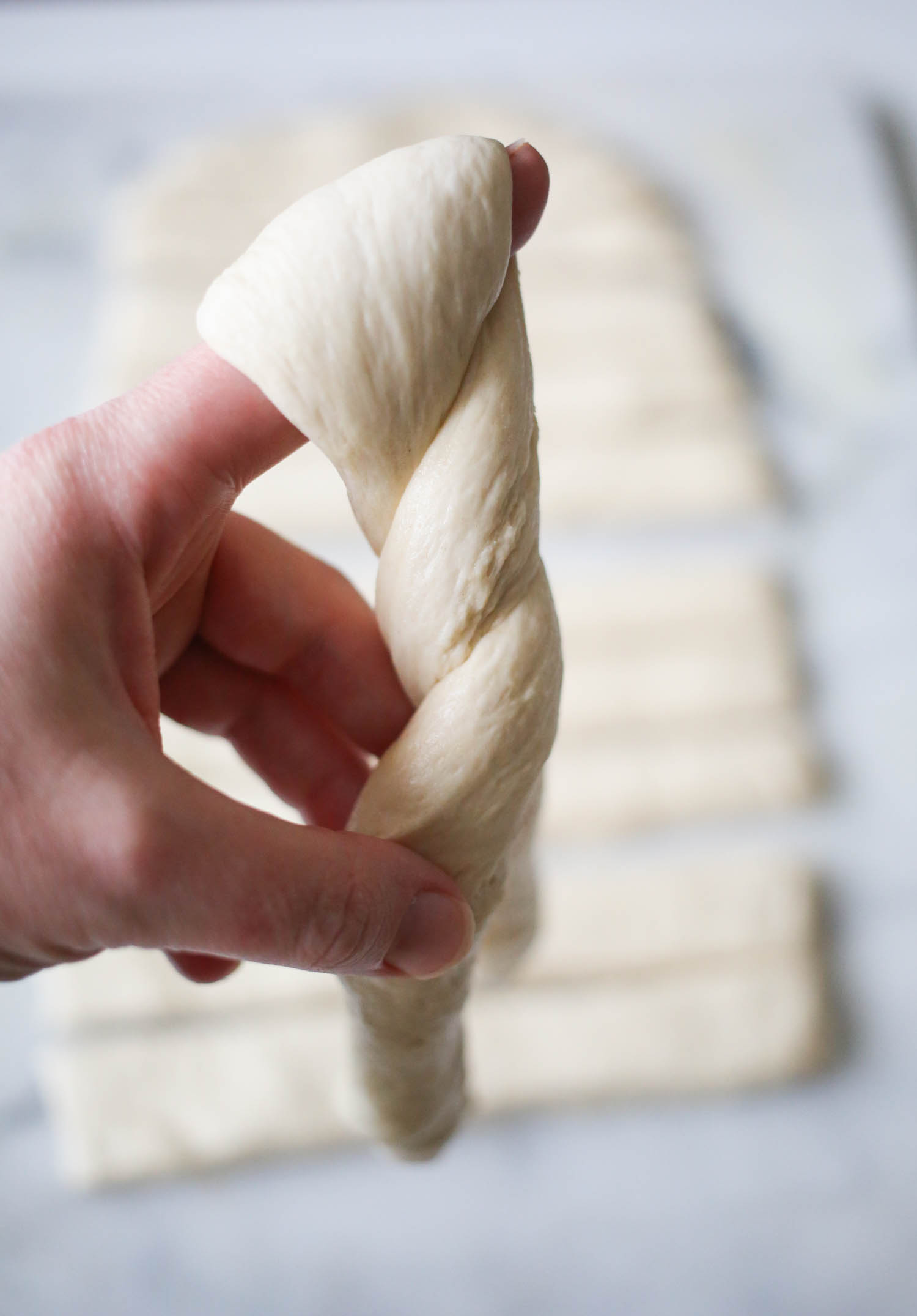 twisting dough for breadsticks from our best bites