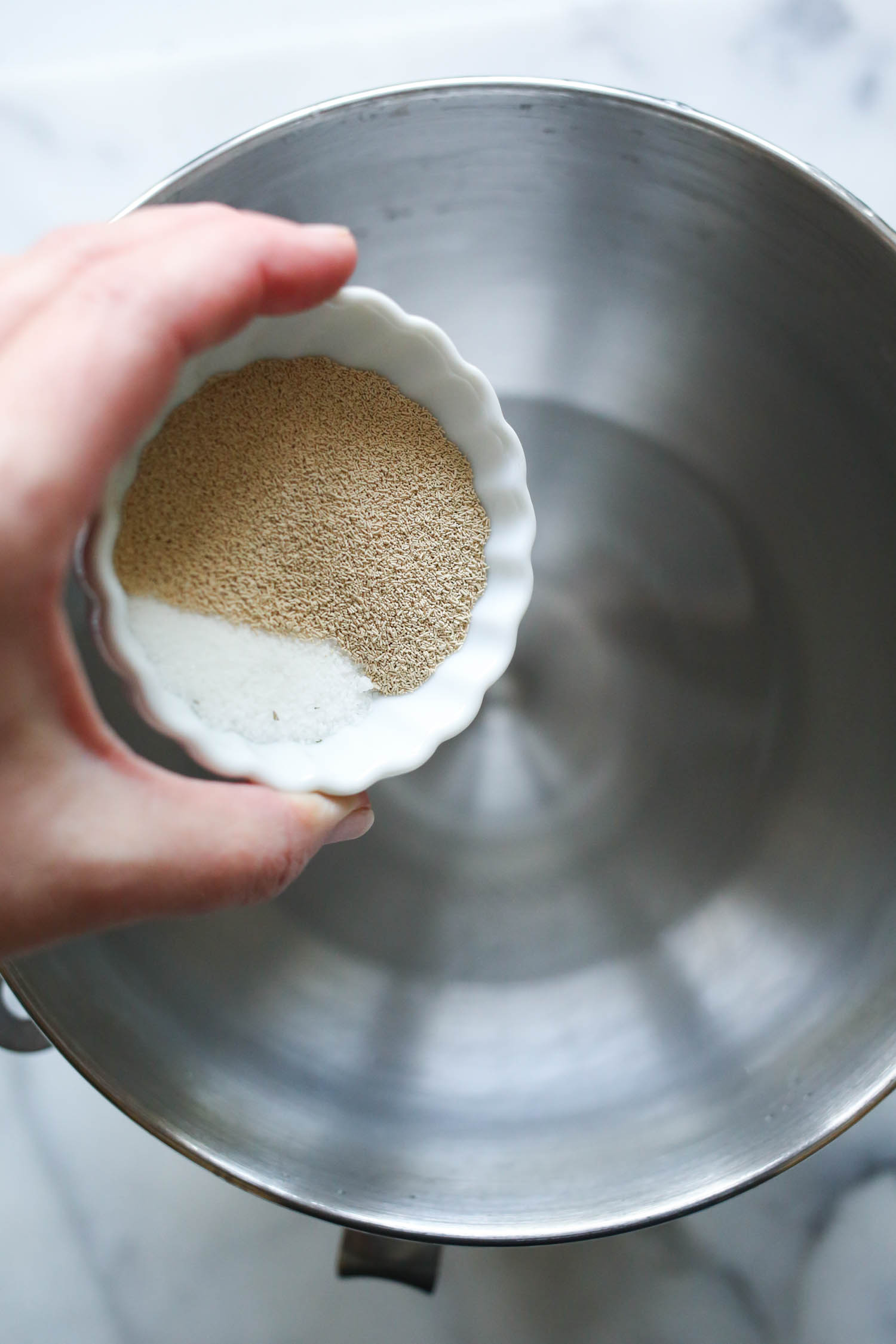 adding sugar and yeast to breadsticks from our best bites