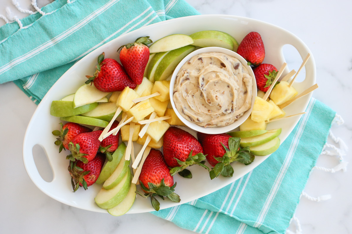 caramel dip on a platter with fruit