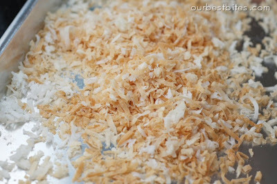 toasted coconut flakes on baking sheet