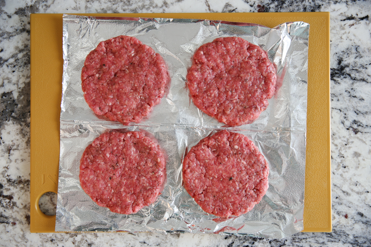 beef patties on a cutting board