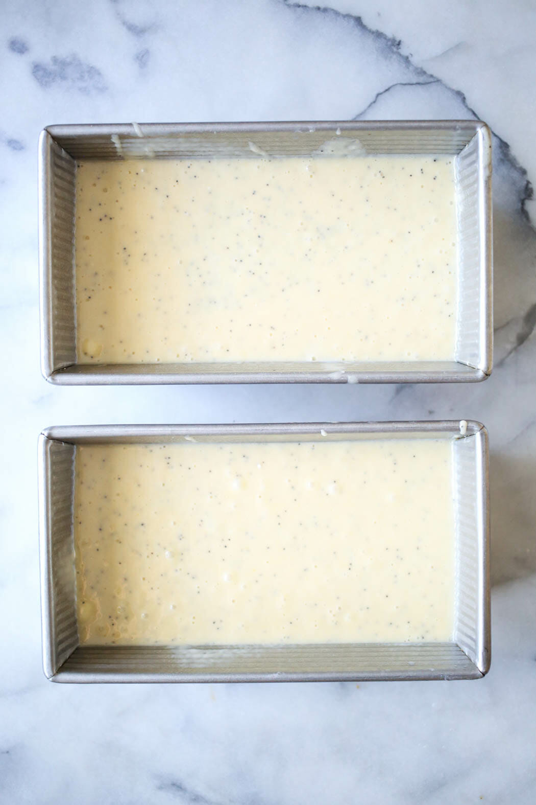 almond poppy seed batter in pans