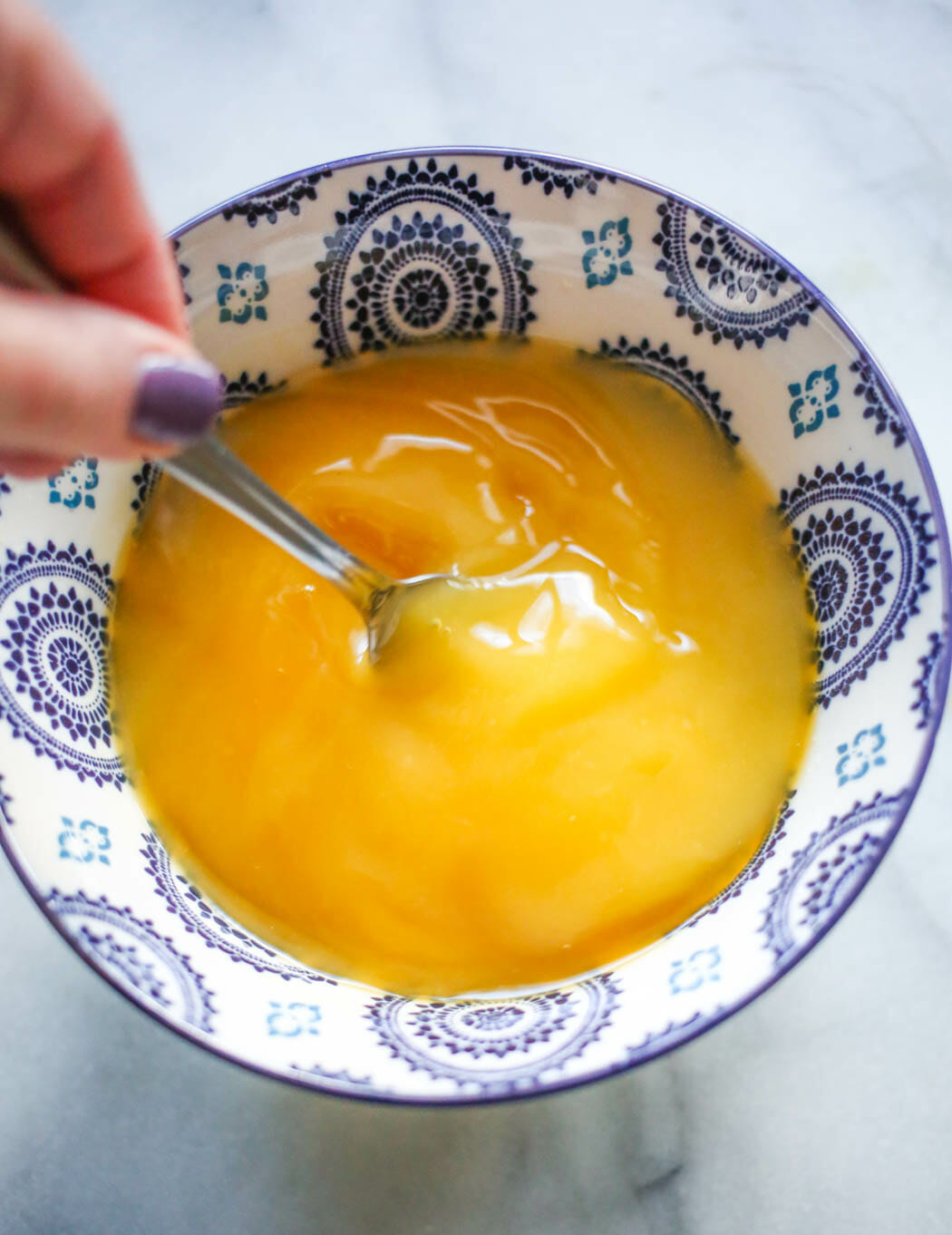 whisking together glaze ingredients