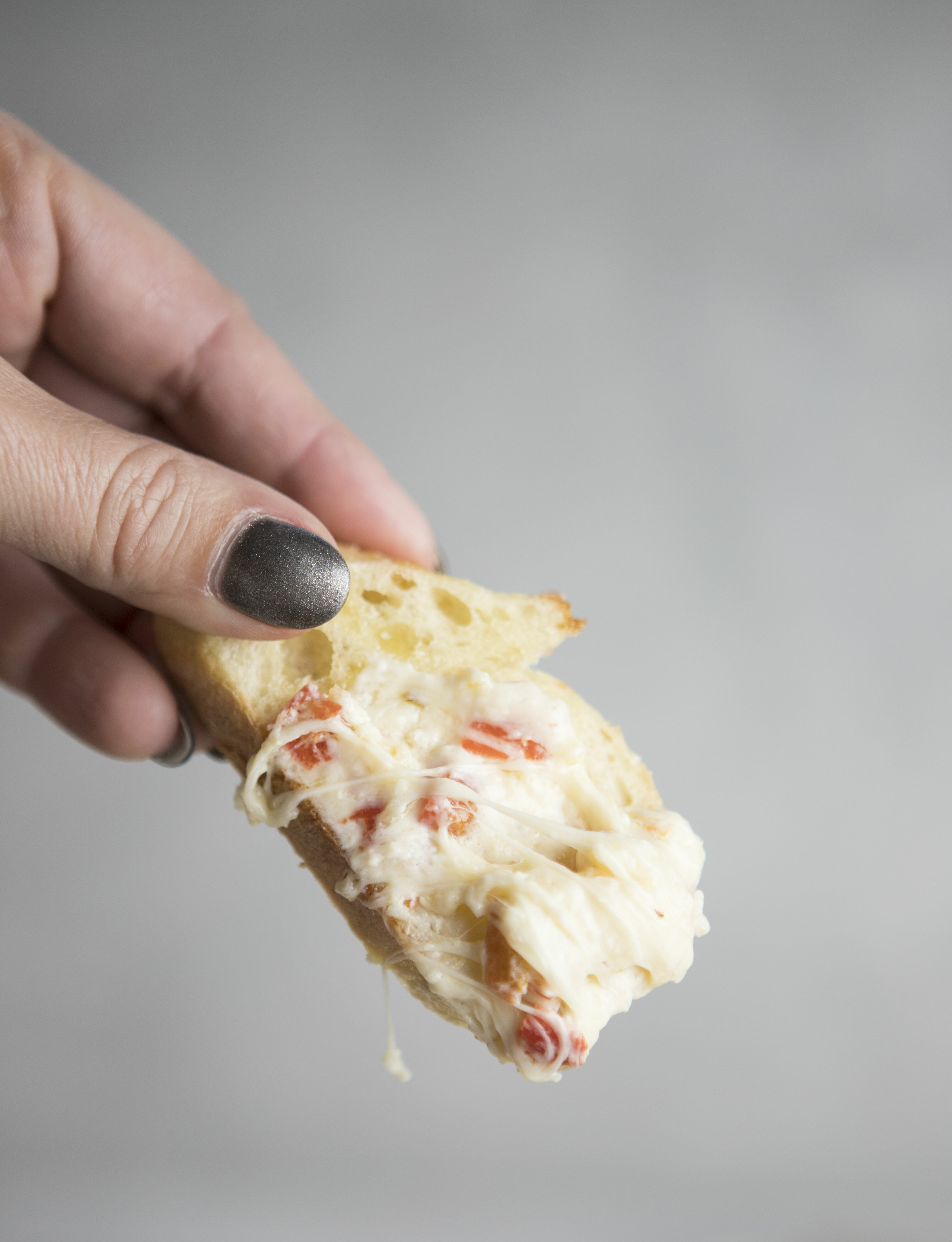 Roasted Red Pepper Dip on a baguette