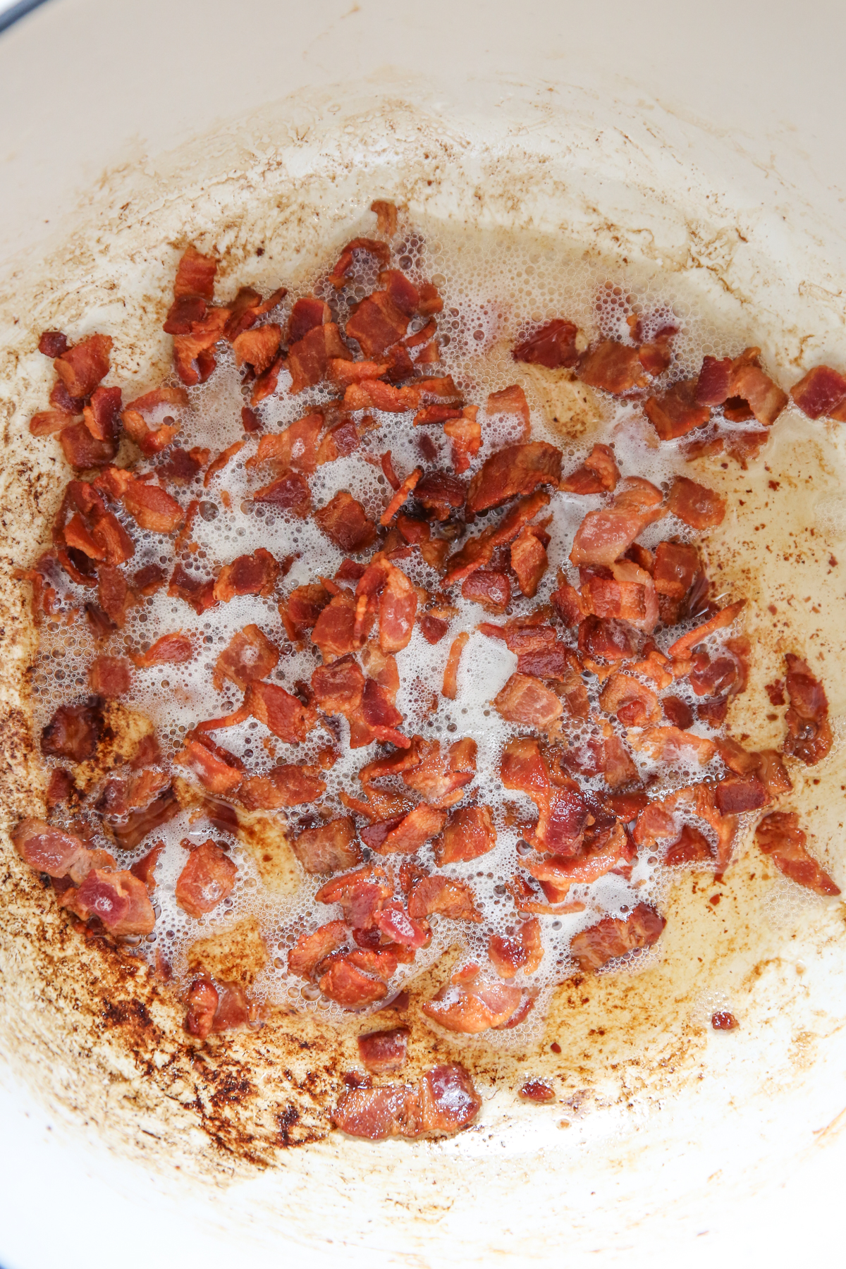 cooked crumbled bacon in a pot