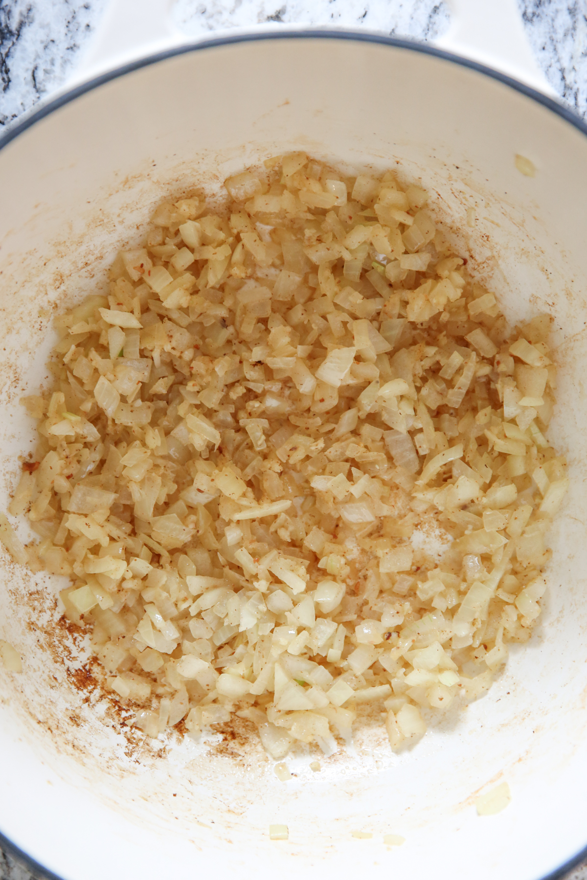 sauteed onions in a white pot