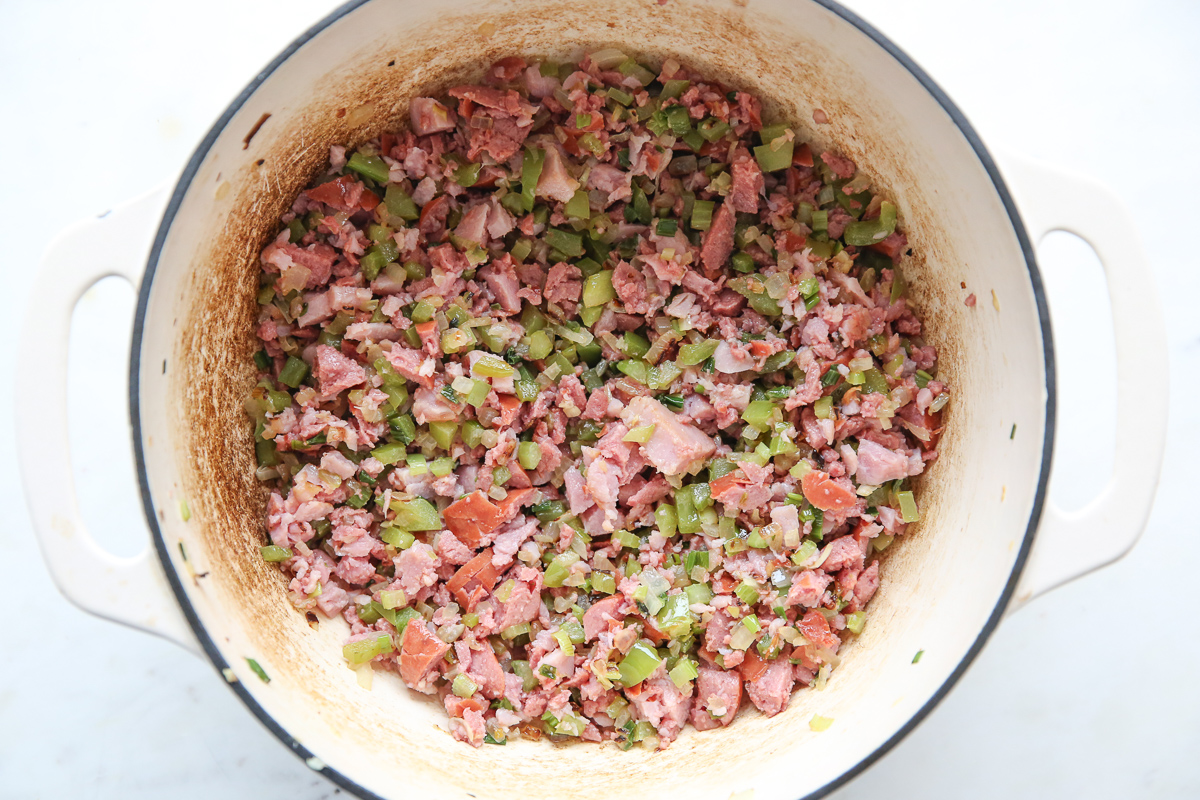 cooked crumbled sausage and ham with vegetables