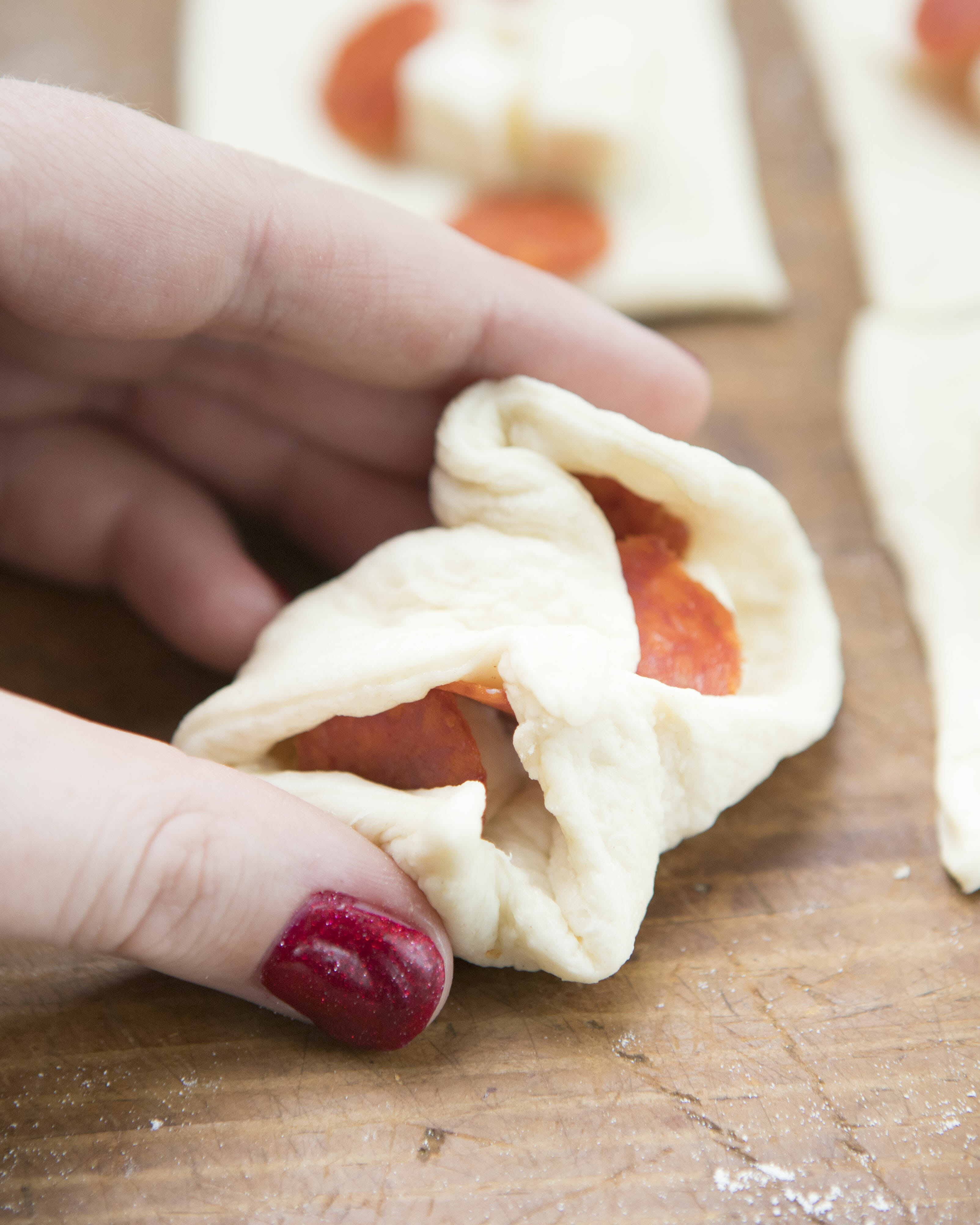 folding stuffed pizza rolls 2