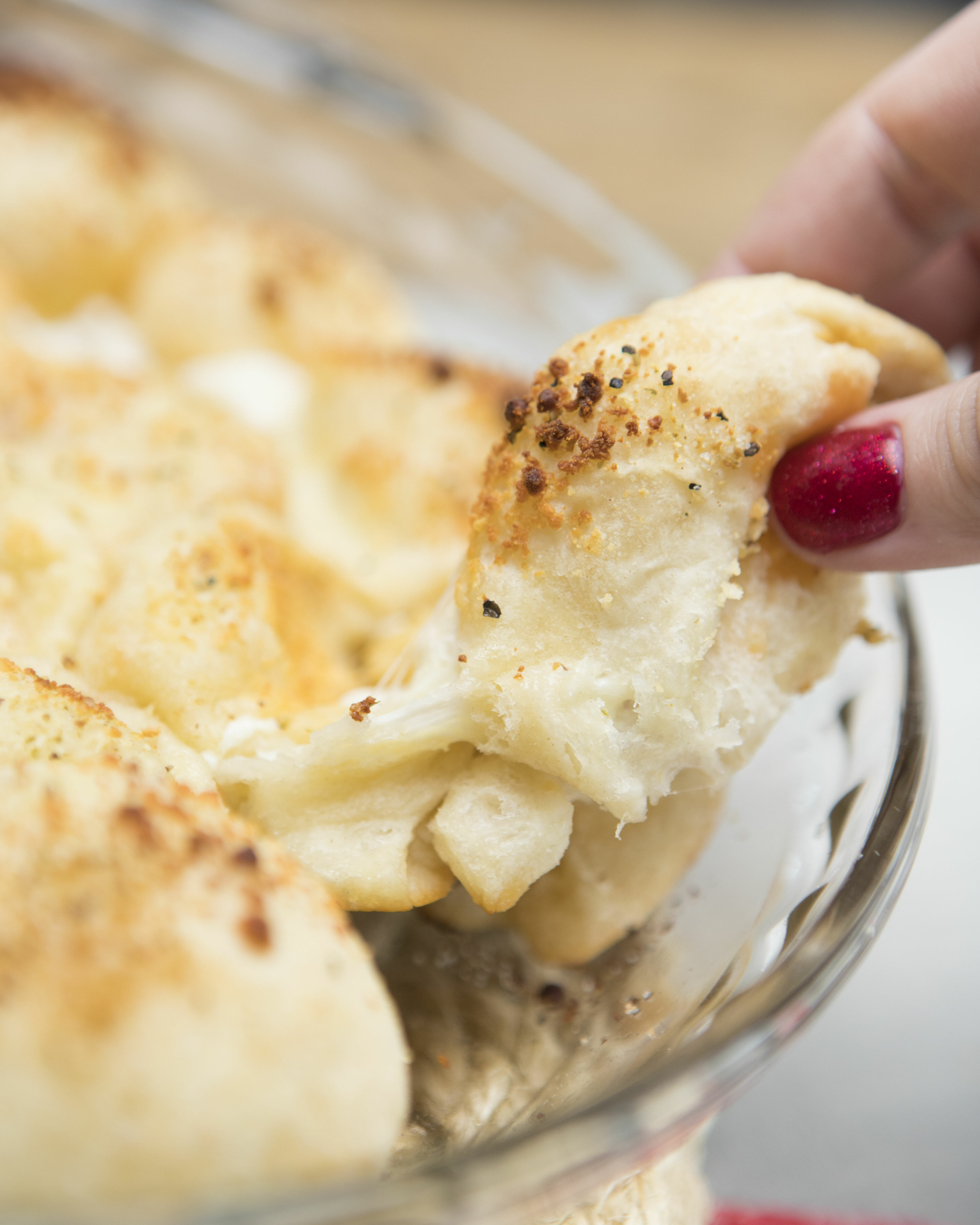 pulling pizza roll from pan