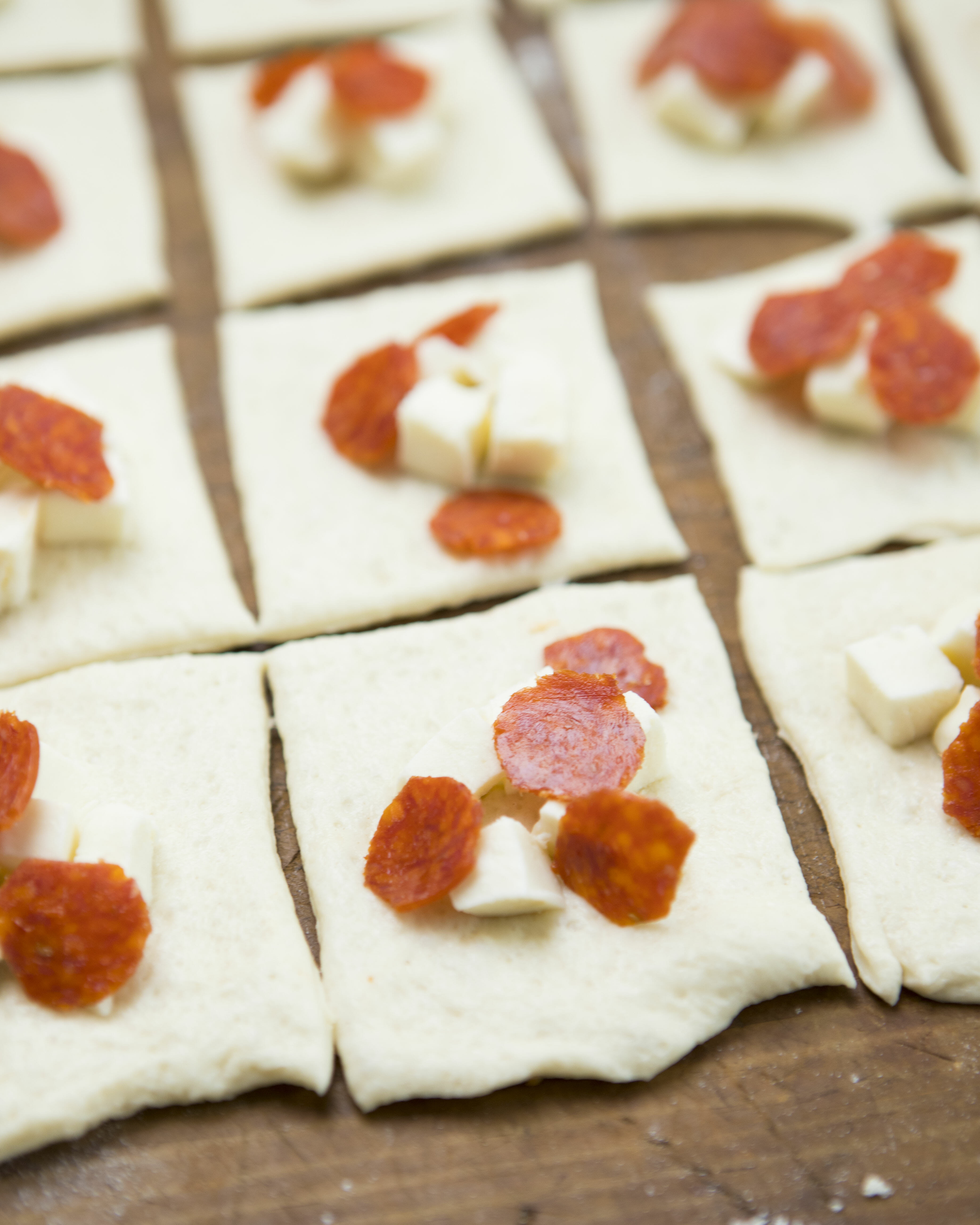 pizza toppings on dough pieces