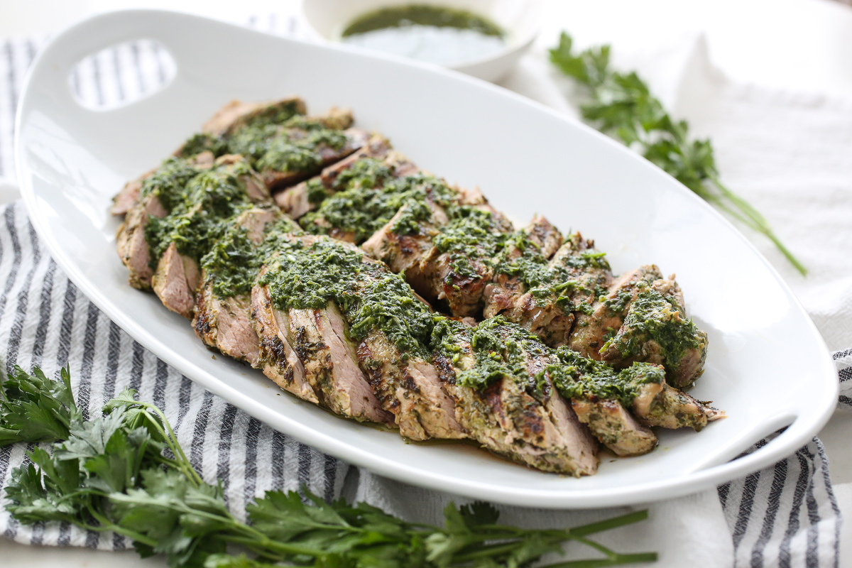 chimichurri pork tenderloin on a serving platter