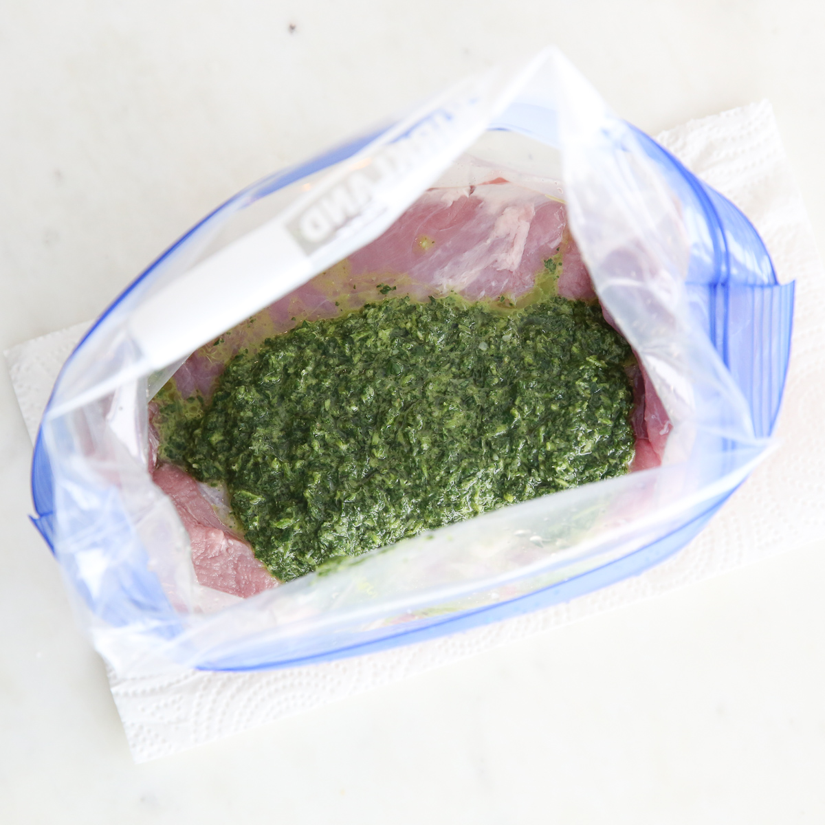 pork tenderloin marinating with chimichurri