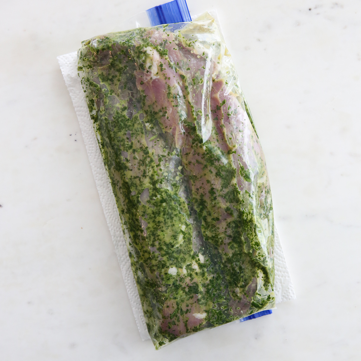 pork tenderloin marinating with chimichurri