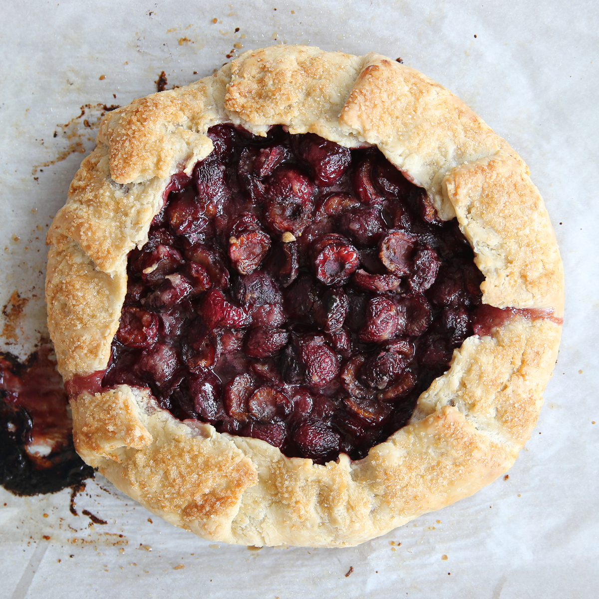 cooked cherry gallette on parchment paper