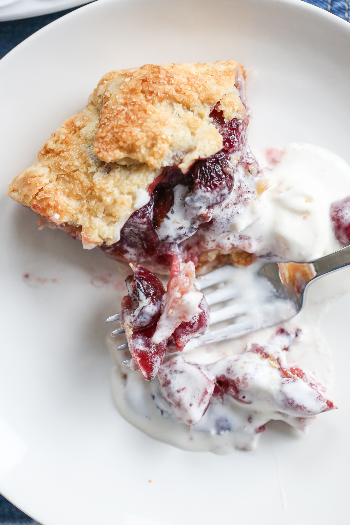 sliced piece of galette with ice cream melting on top