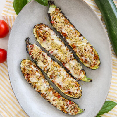 Grilled stuffed zucchini on a platter