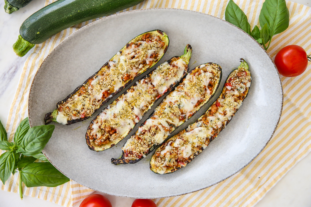 Grilled stuffed zucchini on a platter