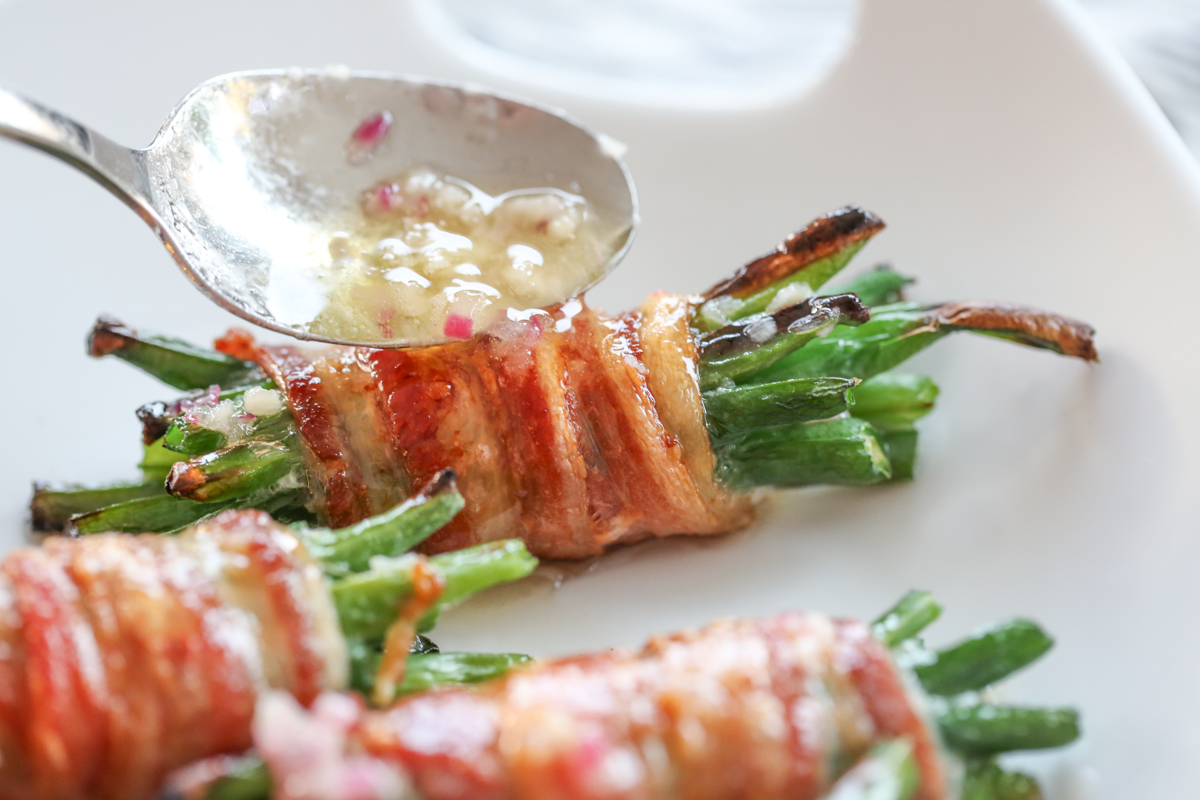 bacon green bean bundles drizzled with sa