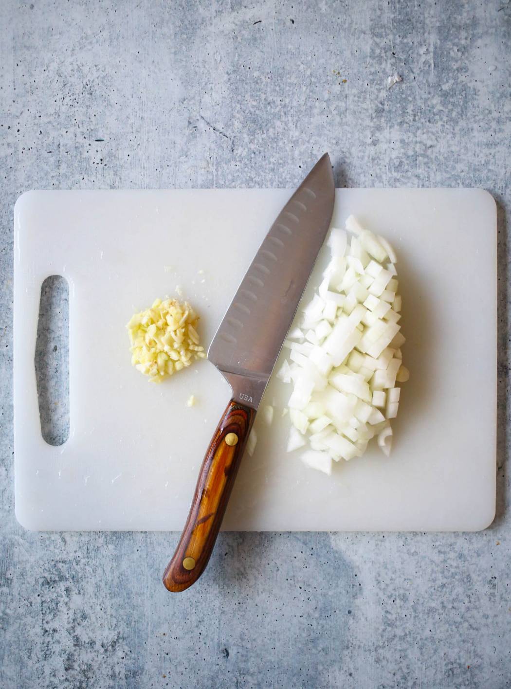 chopped garlic and onion for chicken pot pie from our best bites