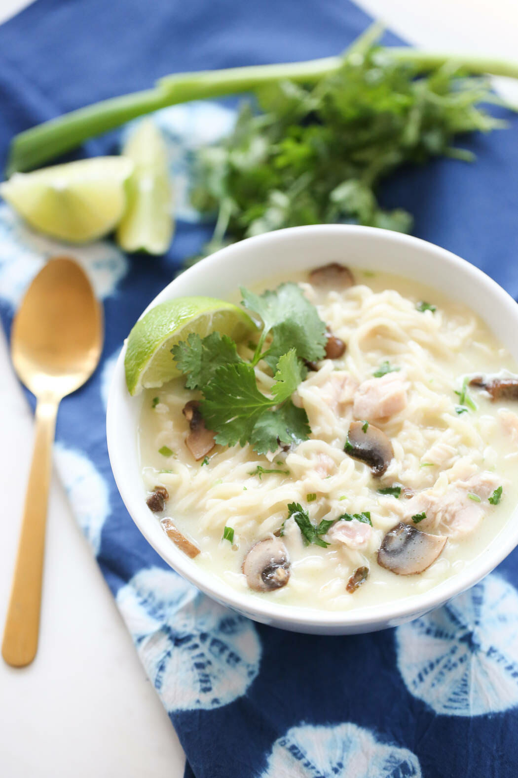 Creamy soup with noodles in a white bowl