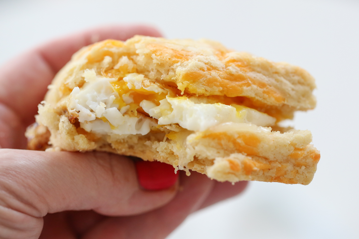 Buttermilk biscuit sliced with fried egg inside