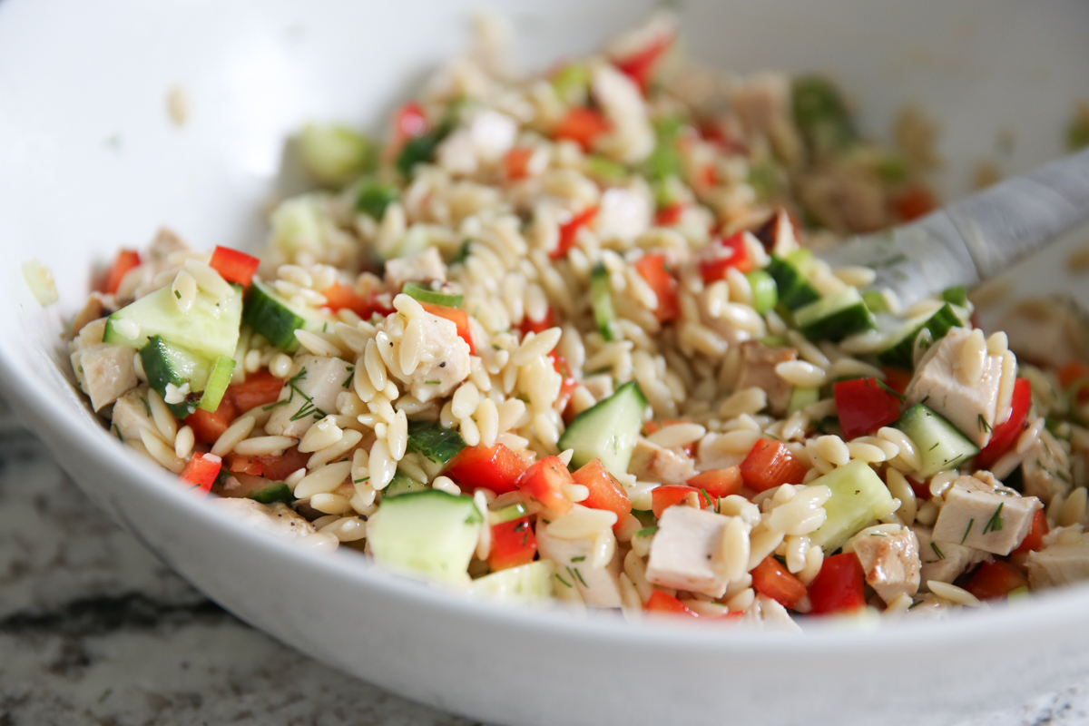 orzo salad in serving bowl