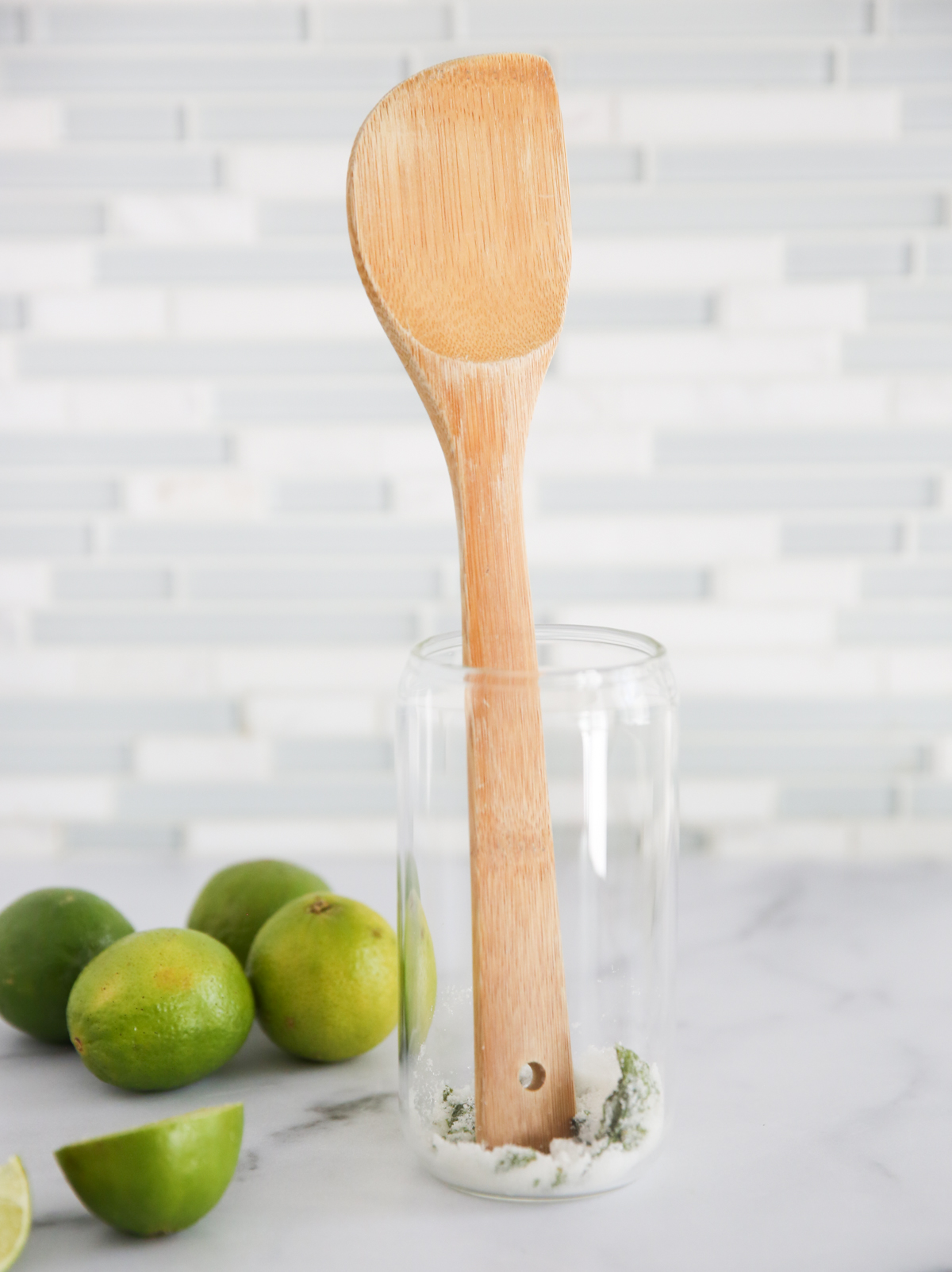 smashing sugar and mint with spoon