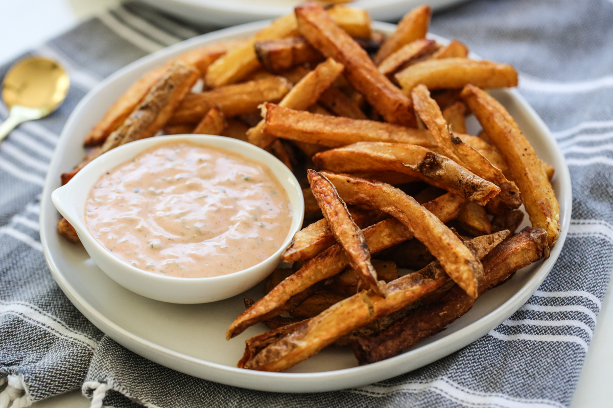 dipping sauce with fries on a platter
