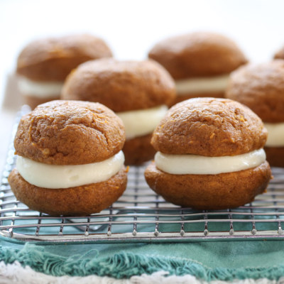 pumpkin whoopie pies on a cooling rack