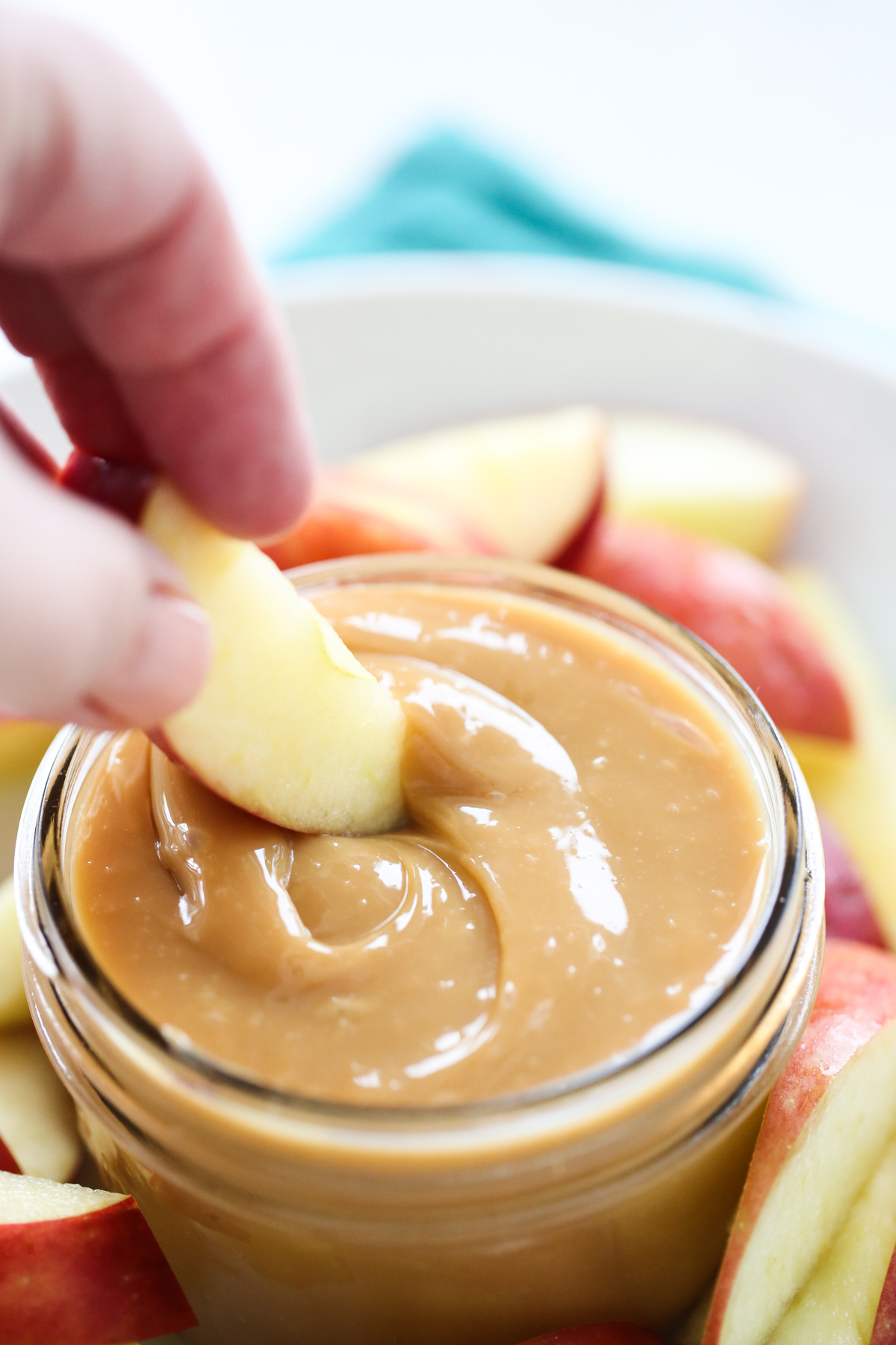 dipping apples in Dulce de Leche