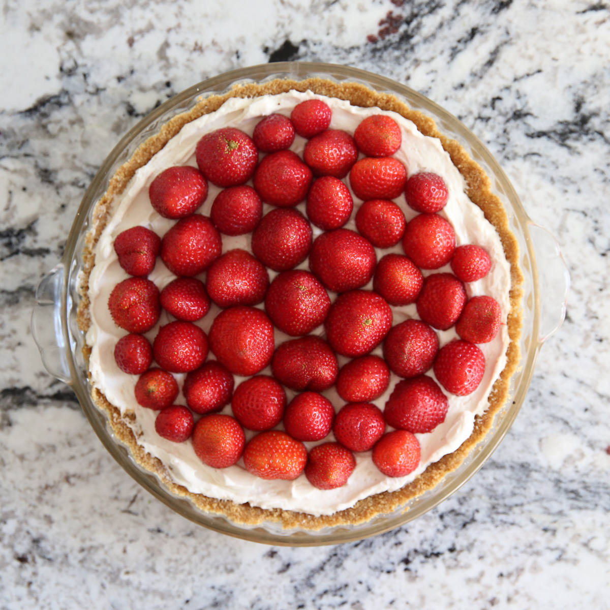 strawberries on top of a pie