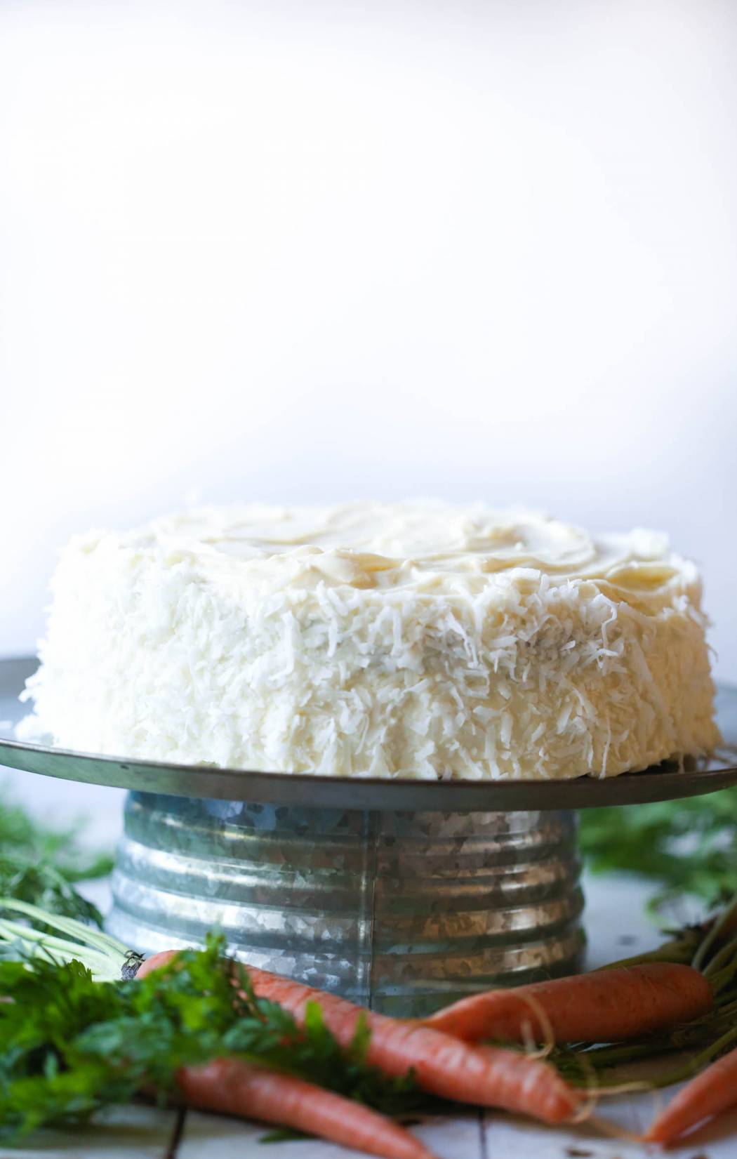 carrot cake on metal stand