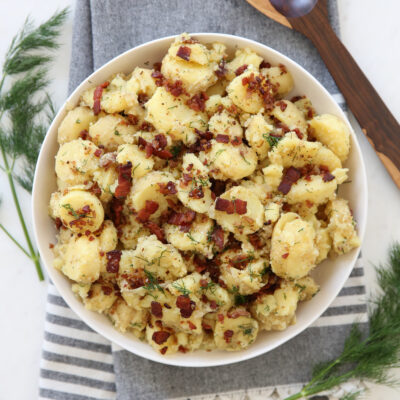 German potato salad in a white serving bowl