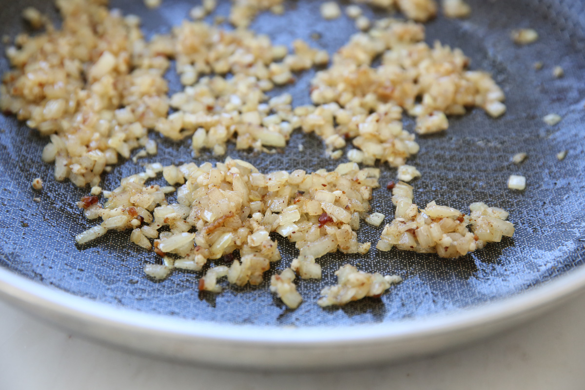 cooking onions in a skillet