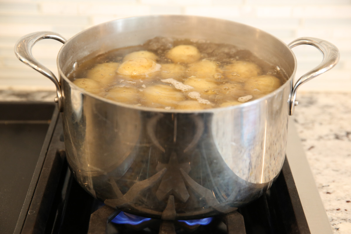 potatoes simmering in a pot of water