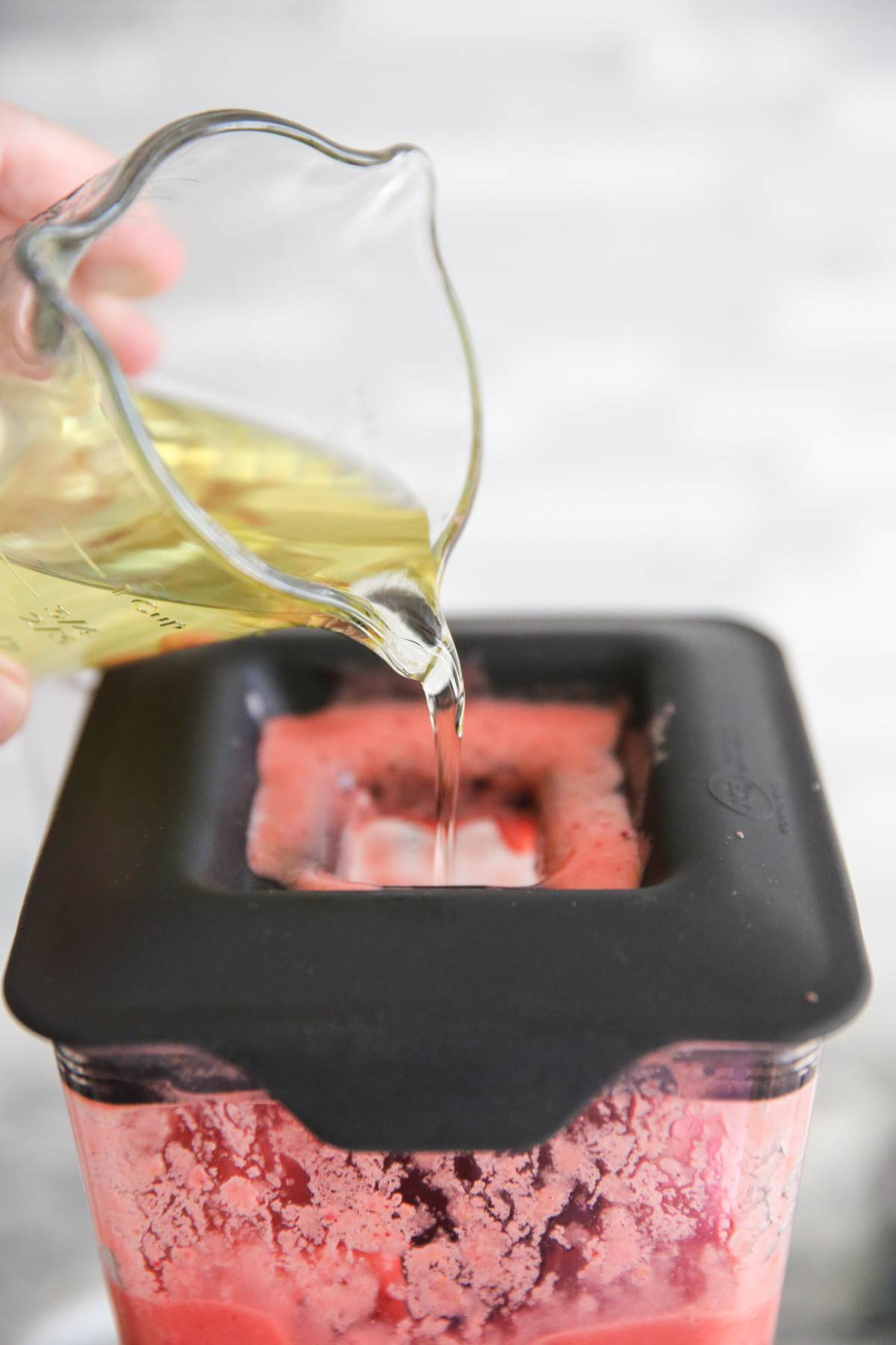 drizzling oil into blender