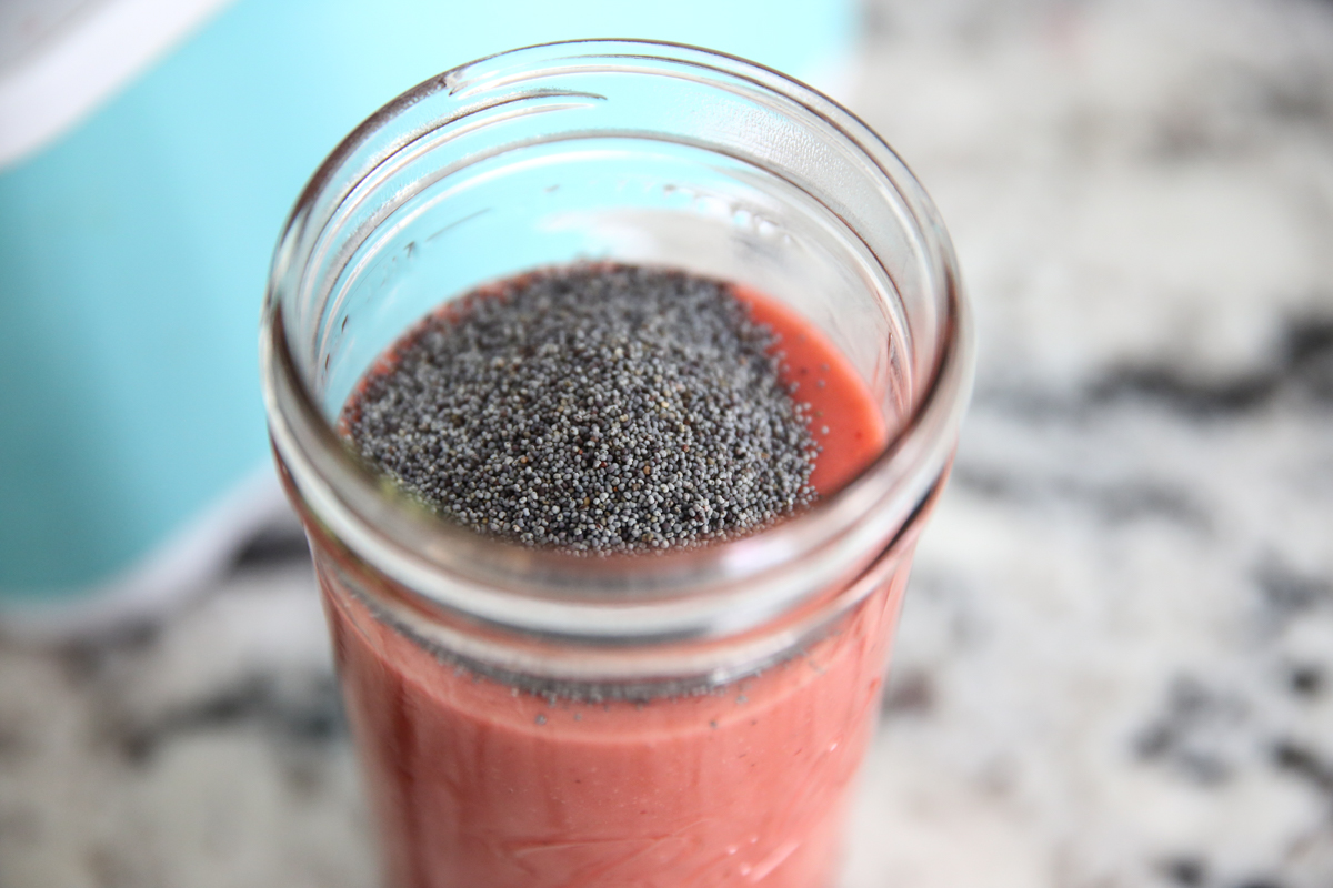 adding poppyseeds to mason jar