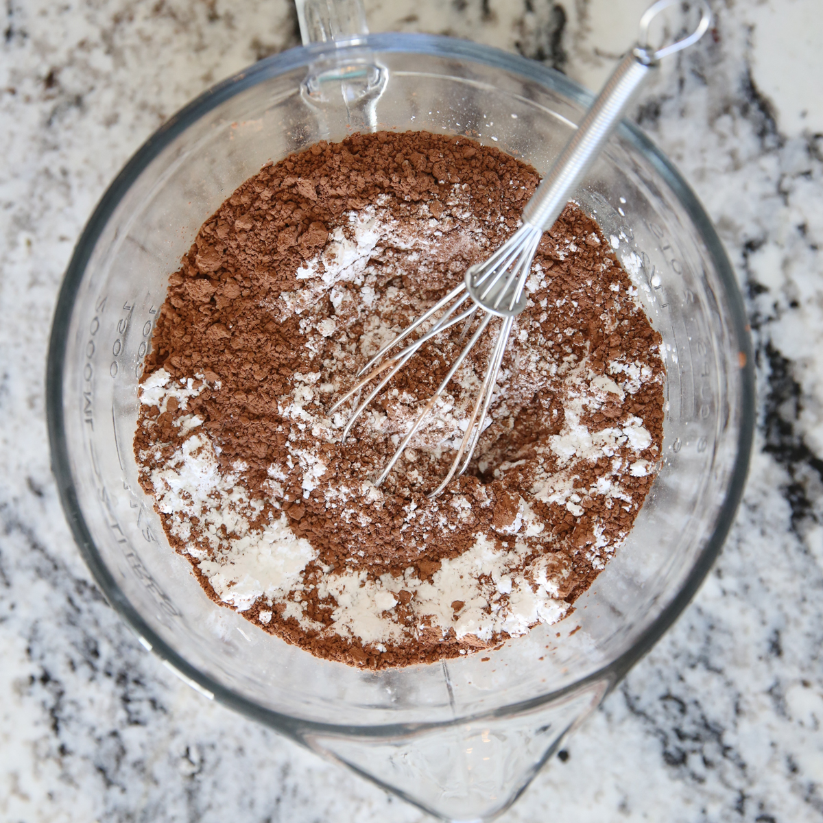 dry frosting ingredients in a mixing bowl