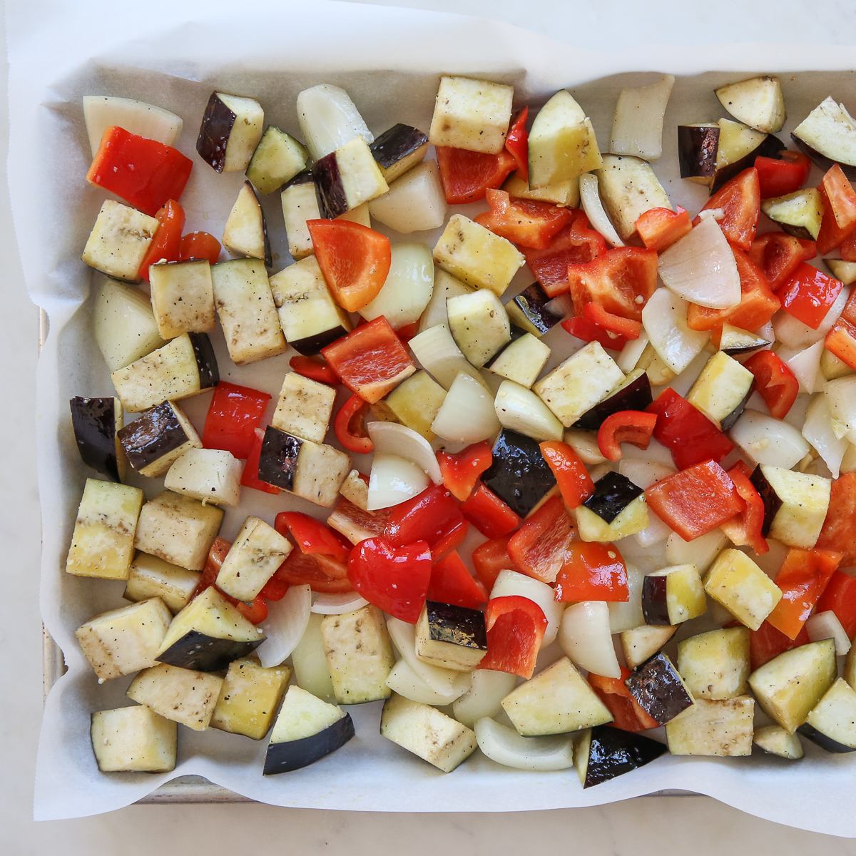 chopped vegetables on a sheet pan