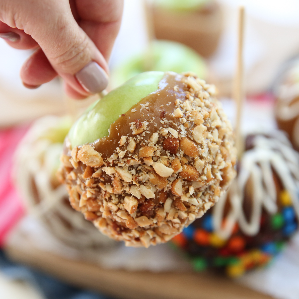 caramel apple with chopped peanuts