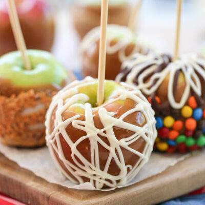 caramel apple on a cutting board