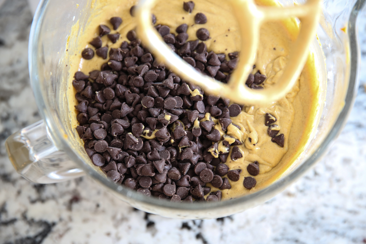 adding chocolate chips into batter