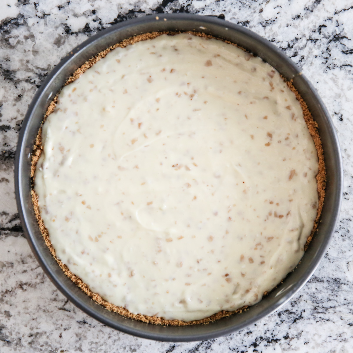 cheesecake batter in a pan