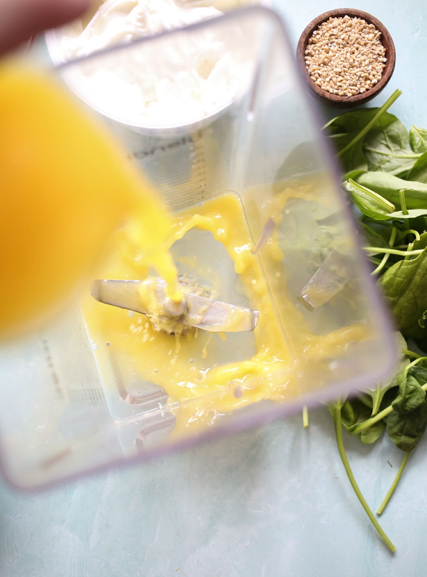 adding orange juice to power smoothie