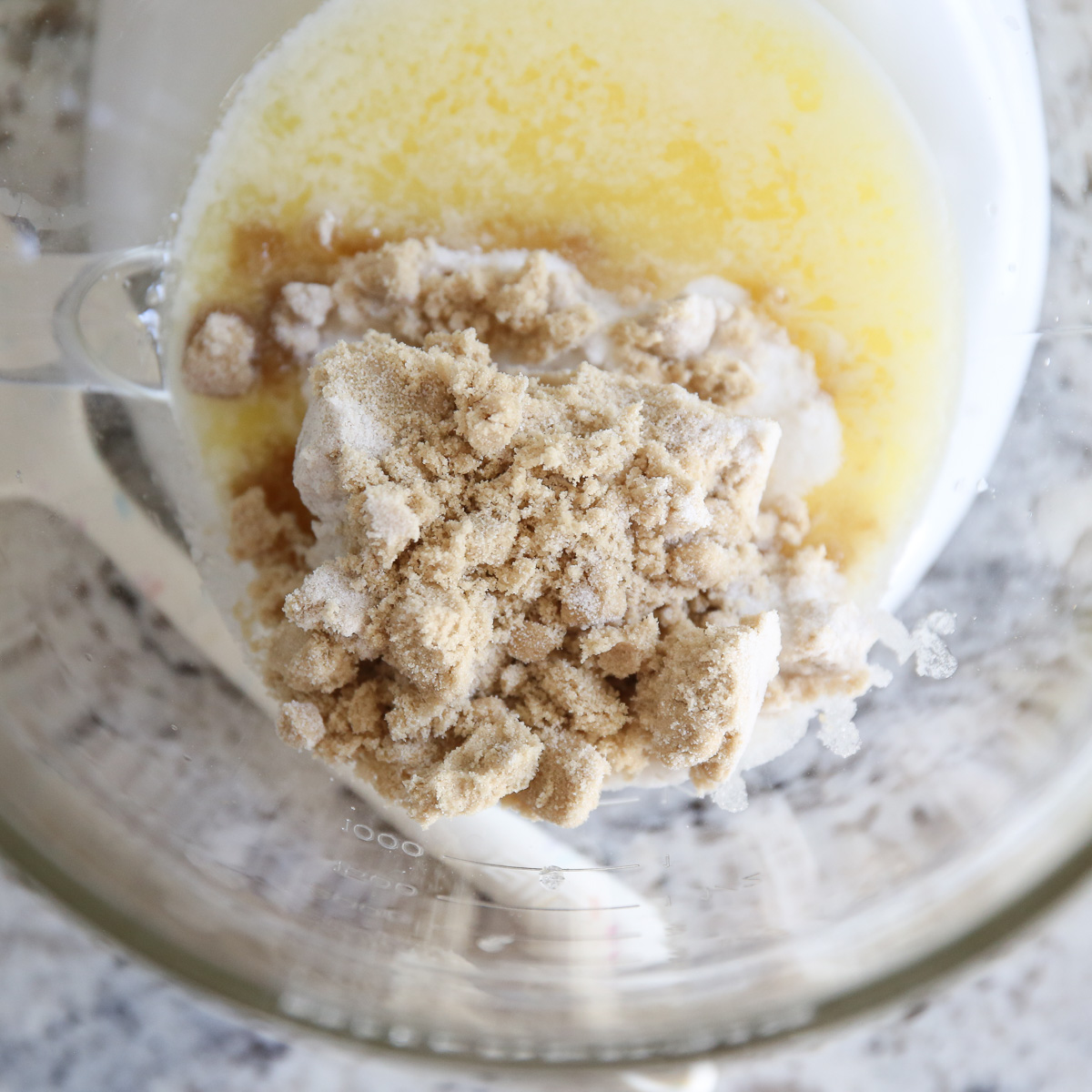 melted butter and sugars in a mixing bowl