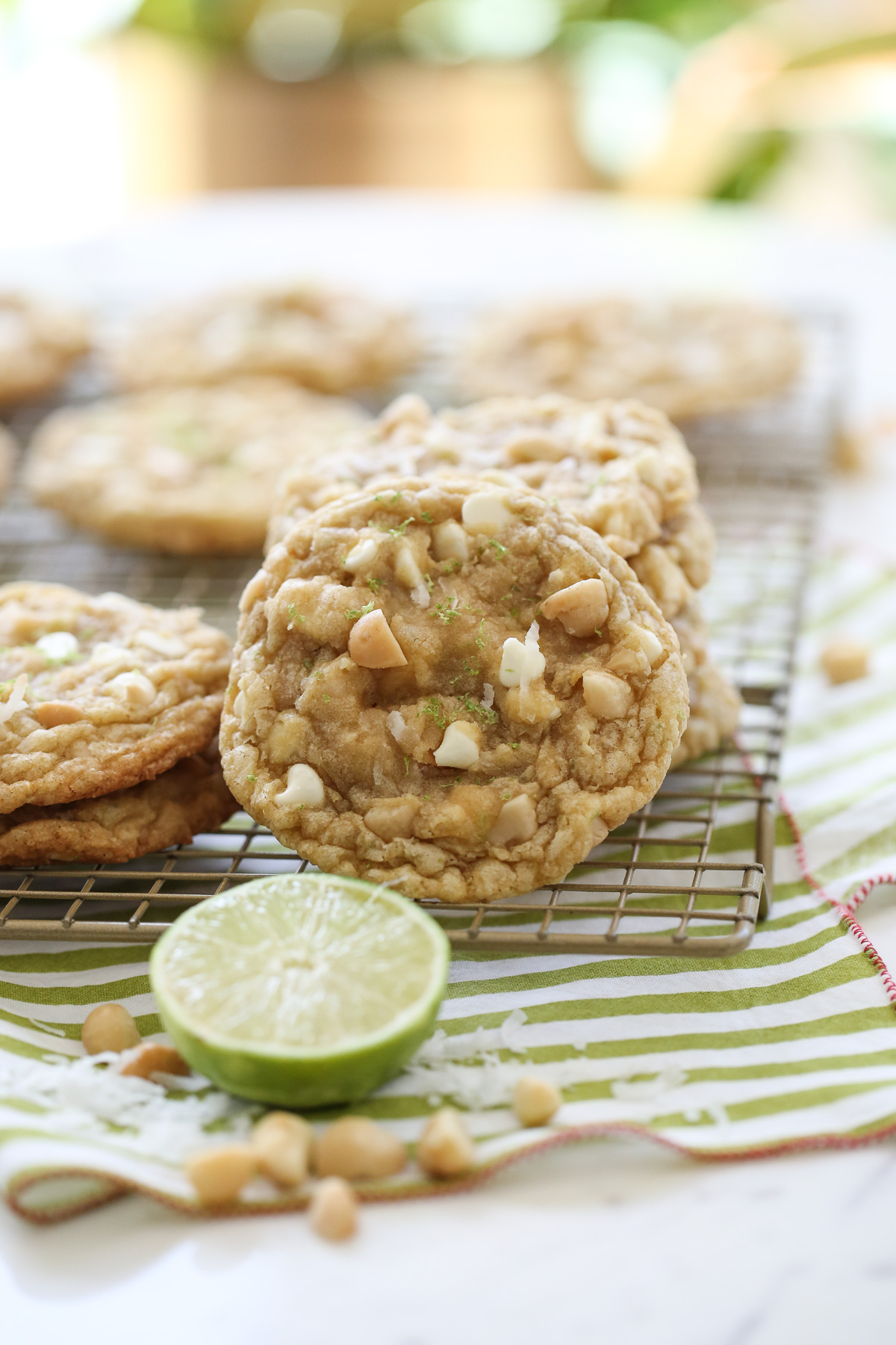 White chocolate chip cookies with a lime in foreground