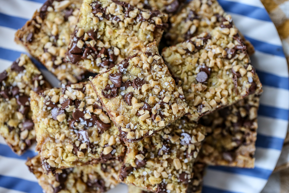 offee Chocolate Chip Cookie Bars stacked on a striped plate
